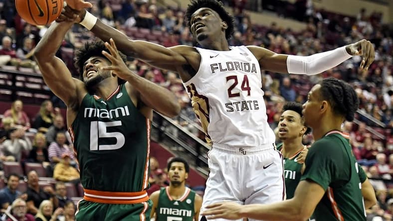 Jan 24, 2023; Tallahassee, Florida, USA; Miami Hurricanes forward Norchad Omier (15) fights for a rebound against Florida State Seminoles center Naheem McLeod (24) during the second half at Donald L. Tucker Center. Mandatory Credit: Melina Myers-USA TODAY Sports