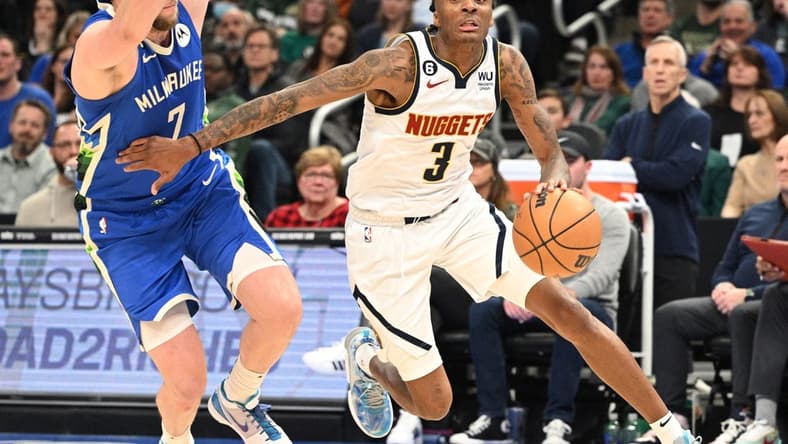 Jan 25, 2023; Milwaukee, Wisconsin, USA; Denver Nuggets guard Bones Hyland (3) drives to the basket against Milwaukee Bucks guard Joe Ingles (7) in the second half at Fiserv Forum. Mandatory Credit: Michael McLoone-USA TODAY Sports