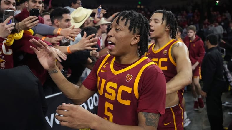 Jan 26, 2023; Los Angeles, California, USA; Southern California Trojans guard Boogie Ellis (5) celebrates with fans after the game against the UCLA Bruins at Galen Center. Mandatory Credit: Kirby Lee-USA TODAY Sports