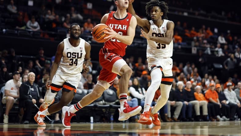 Jan 26, 2023; Corvallis, Oregon, USA; Utah Utes guard Lazar Stefanovic (20) drives to the basket against Oregon State Beavers forward Glenn Taylor Jr. (35) during the second half at Gill Coliseum. Mandatory Credit: Soobum Im-USA TODAY Sports