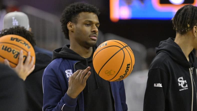 Jan 27, 2023; Los Angeles, CA, USA;  Sierra Canyon Trailblazers point guard Bronny James (0) looks on during warm up for the Battle of the Valley against the Notre Dame Knights played at Pauley Pavilion. James did not play because of a knee injury. Mandatory Credit: Jayne Kamin-Oncea-USA TODAY Sports