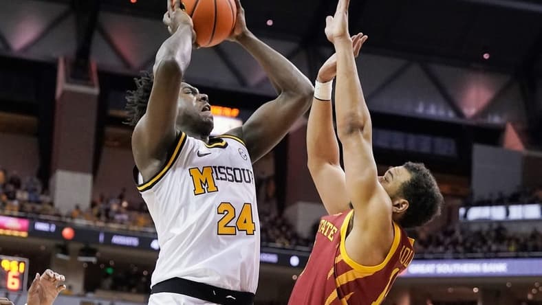 Jan 28, 2023; Columbia, Missouri, USA; Missouri Tigers guard Kobe Brown (24) shoots the ball against Iowa State Cyclones guard Jaren Holmes (13) during the first half at Mizzou Arena. Mandatory Credit: Denny Medley-USA TODAY Sports