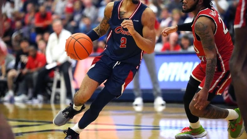 Jan 28, 2023; Boca Raton, Florida, USA; Florida Atlantic Owls guard Nicholas Boyd (2) drives toward the basket as Western Kentucky Hilltoppers guard Dayvion McKnight (20) defends during the first half at Eleanor R. Baldwin Arena. Mandatory Credit: Jim Rassol-USA TODAY Sports