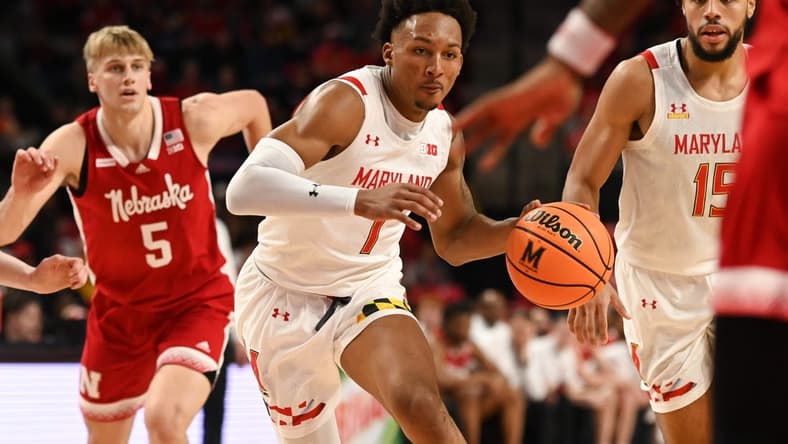 Jan 28, 2023; College Park, Maryland, USA; Maryland Terrapins guard Jahmir Young (1) splits Nebraska Cornhuskers defenders on the way to the basket during the second half at Xfinity Center. Mandatory Credit: Tommy Gilligan-USA TODAY Sports