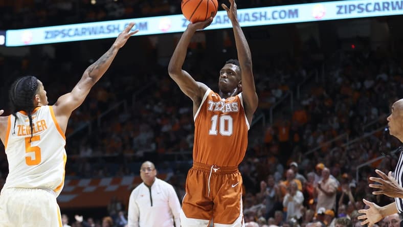 Jan 28, 2023; Knoxville, Tennessee, USA; Texas Longhorns guard Sir'Jabari Rice (10) shoots the ball against Tennessee Volunteers guard Zakai Zeigler (5) during the second half at Thompson-Boling Arena. Mandatory Credit: Randy Sartin-USA TODAY Sports