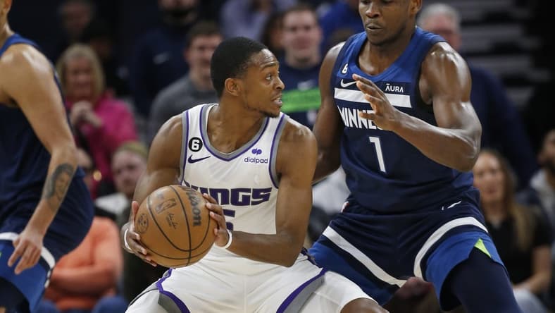 Jan 30, 2023; Minneapolis, Minnesota, USA; Sacramento Kings guard De'Aaron Fox (5) tries to work around Minnesota Timberwolves forward Anthony Edwards (1) in the fourth quarter at Target Center. Mandatory Credit: Bruce Kluckhohn-USA TODAY Sports