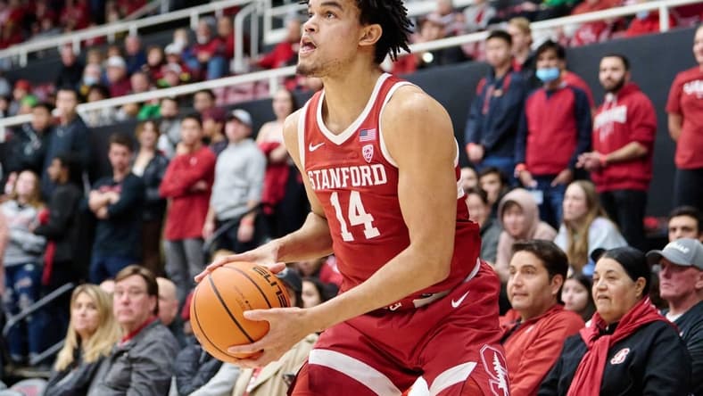 Jan 21, 2023; Stanford, California, USA; Stanford Cardinal forward Spencer Jones (14) holds the ball against the Oregon Ducks during the first half at Maples Pavilion. Mandatory Credit: Robert Edwards-USA TODAY Sports