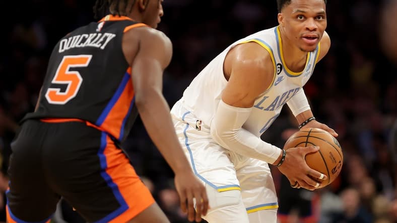 Jan 31, 2023; New York, New York, USA; Los Angeles Lakers guard Russell Westbrook (0) controls the ball against New York Knicks guard Immanuel Quickley (5) during overtime at Madison Square Garden. Mandatory Credit: Brad Penner-USA TODAY Sports