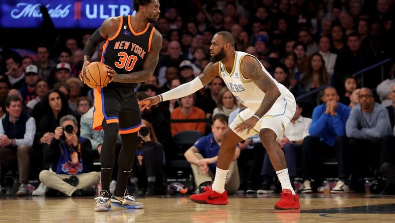 Jan 31, 2023; New York, New York, USA; New York Knicks forward Julius Randle (30) controls the ball against Los Angeles Lakers forward LeBron James (6) during the fourth quarter at Madison Square Garden. Mandatory Credit: Brad Penner-USA TODAY Sports