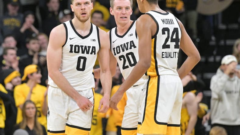 Jan 31, 2023; Iowa City, Iowa, USA; Iowa Hawkeyes forward Filip Rebraca (0) and forward Payton Sandfort (20) and forward Kris Murray (24) react during the second half against the Northwestern Wildcats at Carver-Hawkeye Arena. Mandatory Credit: Jeffrey Becker-USA TODAY Sports