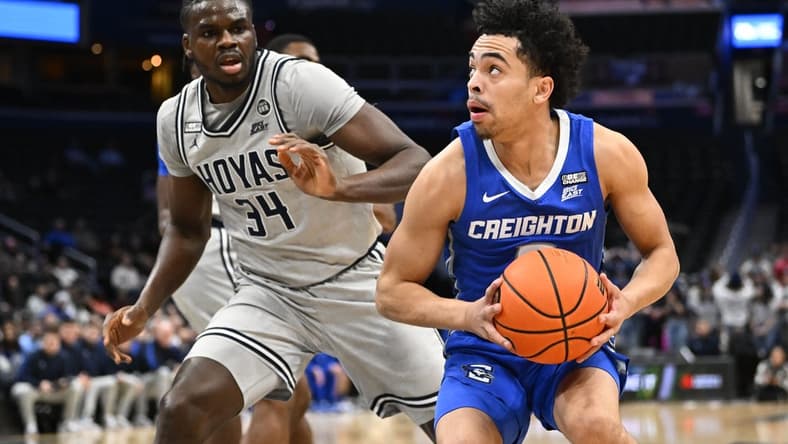 Feb 1, 2023; Washington, District of Columbia, USA; Creighton Bluejays guard Ryan Nembhard (2) prepares to shoot as Georgetown Hoyas center Qudus Wahab (34) defends during the first half at Capital One Arena. Mandatory Credit: Brad Mills-USA TODAY Sports