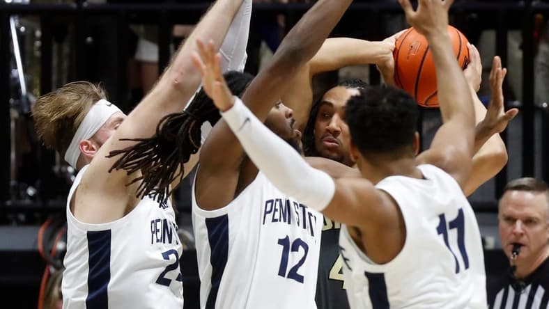 Penn State Nittany Lions forward Michael Henn (24), Penn State Nittany Lions guard Evan Mahaffey (12) and Penn State Nittany Lions guard Camren Wynter (11) defend Purdue Boilermakers forward Trey Kaufman-Renn (4) during the NCAA men s basketball game, Wednesday, Feb. 1, 2023, at Mackey Arena in West Lafayette, Ind. Purdue won 80-60.
Purpennmbb020123 Am17331