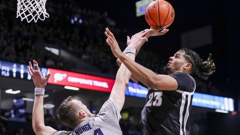 Feb 1, 2023; Cincinnati, Ohio, USA; Providence Friars forward Bryce Hopkins (23) shoots against Xavier Musketeers forward Jack Nunge (24) in the first half at Cintas Center. Mandatory Credit: Katie Stratman-USA TODAY Sports