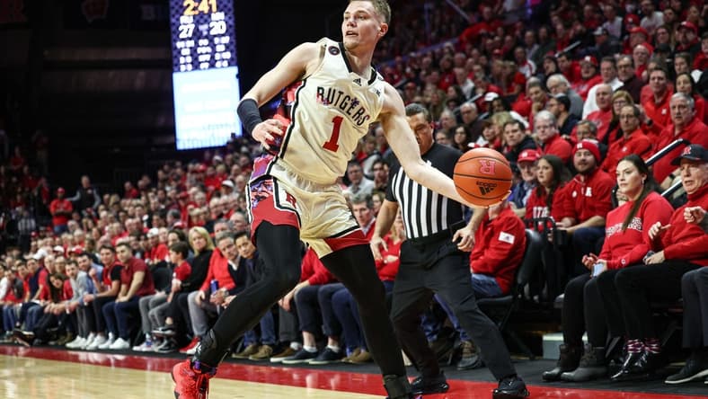 Feb 1, 2023; Piscataway, New Jersey, USA; Rutgers Scarlet Knights forward Oskar Palmquist (1) saves the ball from going out of bounds during the first half against the Minnesota Golden Gophers at Jersey Mike's Arena. Mandatory Credit: Vincent Carchietta-USA TODAY Sports