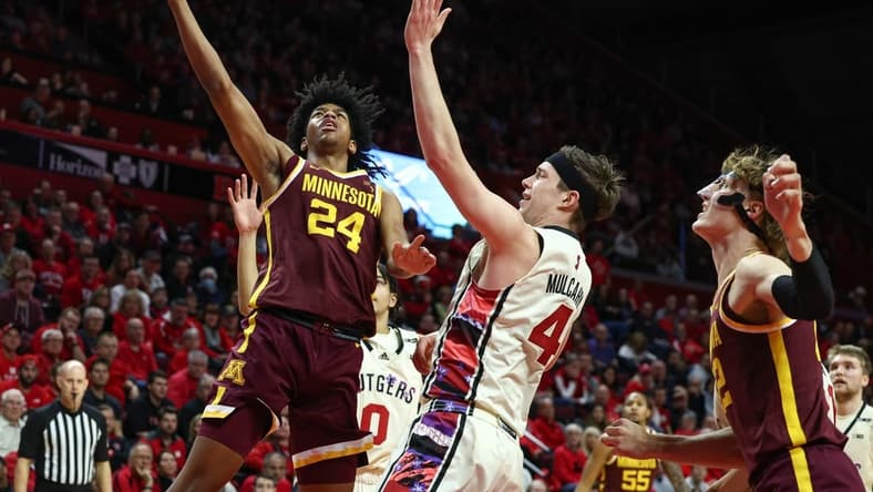 Feb 1, 2023; Piscataway, New Jersey, USA; Minnesota Golden Gophers forward Jaden Henley (24) moves to the basket as Rutgers Scarlet Knights guard Paul Mulcahy (4) defends during the first half at Jersey Mike's Arena. Mandatory Credit: Vincent Carchietta-USA TODAY Sports