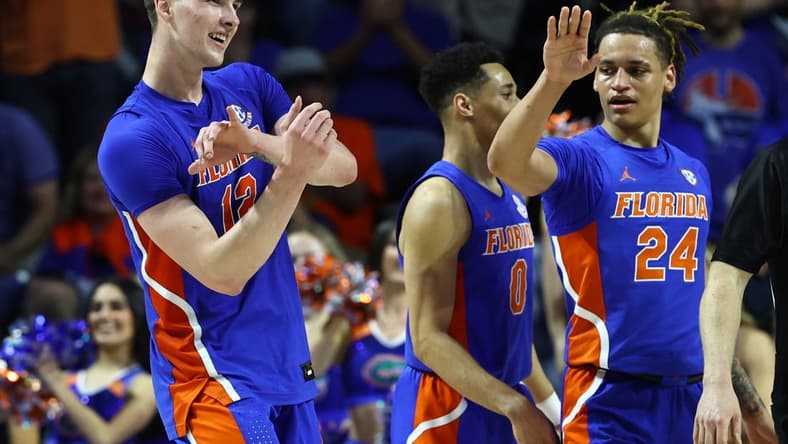 Feb 1, 2023; Gainesville, Florida, USA; Florida Gators forward Colin Castleton (12) celebrates after making a basket against the Tennessee Volunteers during the second half at Exactech Arena at the Stephen C. O'Connell Center. Mandatory Credit: Kim Klement-USA TODAY Sports