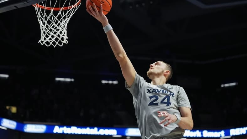 Xavier Musketeers forward Jack Nunge (24) scores a basket in the first half of a college basketball game between the Providence Friars and the Xavier Musketeers, Wednesday, Feb. 1, 2023, at Cintas Center in Cincinnati.

Providence Friars At Xavier Musketeers Feb 1 0010