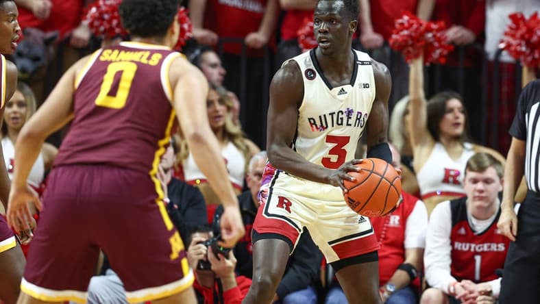 Feb 1, 2023; Piscataway, New Jersey, USA; Rutgers Scarlet Knights forward Mawot Mag (3) is defended by Minnesota Golden Gophers guard Taurus Samuels (0) during the first half at Jersey Mike's Arena. Mandatory Credit: Vincent Carchietta-USA TODAY Sports