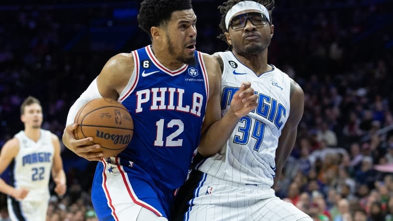 Feb 1, 2023; Philadelphia, Pennsylvania, USA; Philadelphia 76ers forward Tobias Harris (12) drives with the ball against Orlando Magic center Wendell Carter Jr. (34) during the third quarter at Wells Fargo Center. Mandatory Credit: Bill Streicher-USA TODAY Sports