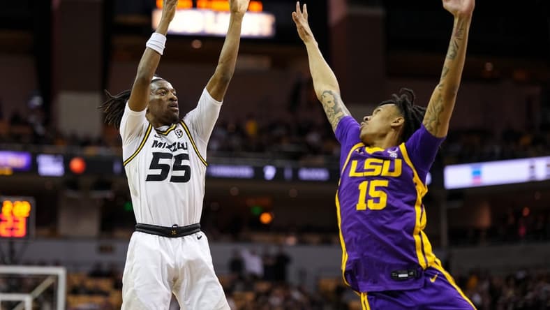 Feb 1, 2023; Columbia, Missouri, USA; Missouri Tigers guard Sean East II (55) shoots over LSU Tigers forward Tyrell Ward (15) during the first half at Mizzou Arena. Mandatory Credit: Jay Biggerstaff-USA TODAY Sports