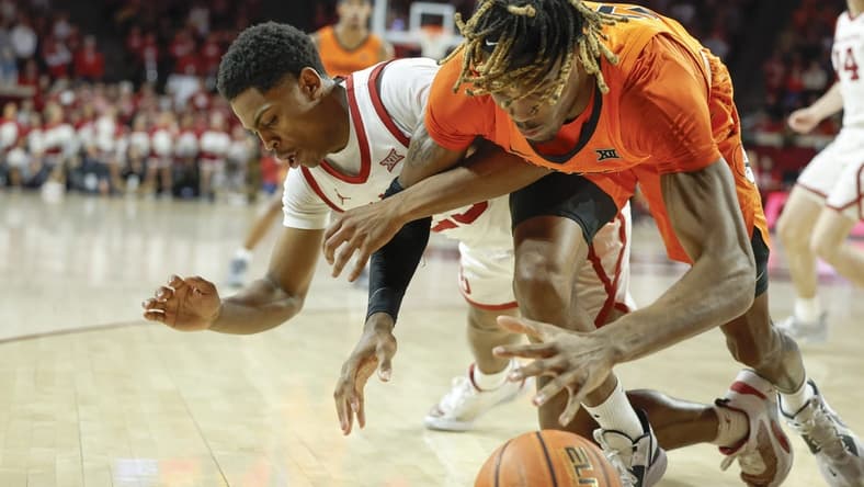 Feb 1, 2023; Norman, Oklahoma, USA; Oklahoma State Cowboys forward Tyreek Smith (23) and Oklahoma Sooners guard Grant Sherfield (25) fight for a loose ball during the first half at Lloyd Noble Center. Mandatory Credit: Alonzo Adams-USA TODAY Sports