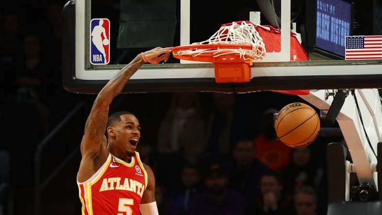 Feb 1, 2023; Phoenix, Arizona, USA; Atlanta Hawks guard Dejounte Murray (5) slam dunks the ball against the Phoenix Suns in the first half at Footprint Center. Mandatory Credit: Mark J. Rebilas-USA TODAY Sports