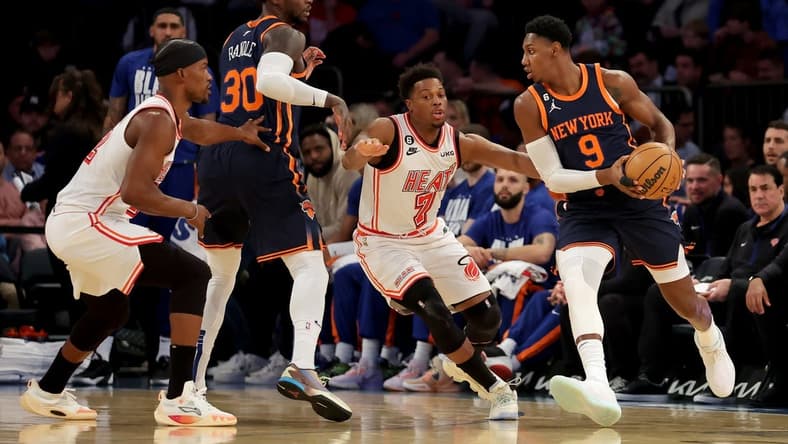 Feb 2, 2023; New York, New York, USA; New York Knicks guard RJ Barrett (9) controls the ball against Miami Heat guard Kyle Lowry (7) during the first quarter at Madison Square Garden. Mandatory Credit: Brad Penner-USA TODAY Sports
