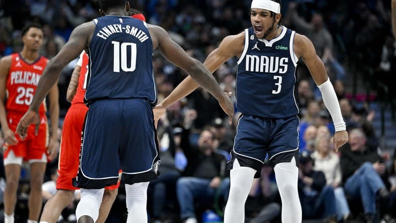 Feb 2, 2023; Dallas, Texas, USA; Dallas Mavericks forward Dorian Finney-Smith (10) and guard Jaden Hardy (3) celebrate during the first half of the game against the New Orleans Pelicans at the American Airlines Center. Mandatory Credit: Jerome Miron-USA TODAY Sports