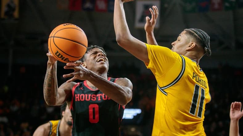 Jan 25, 2023; Wichita, Kansas, USA; Houston Cougars guard Marcus Sasser (0) puts up a shot over Wichita State Shockers forward Kenny Pohto (11) during the first half at Charles Koch Arena. Mandatory Credit: William Purnell-USA TODAY Sports