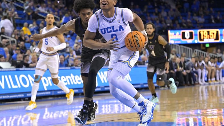Feb 2, 2023; Los Angeles, California, USA; UCLA Bruins guard Jaylen Clark (0) is fouled by Washington Huskies forward Keion Brooks (1) as he drives to the basket in the first half at Pauley Pavilion presented by Wescom. Mandatory Credit: Jayne Kamin-Oncea-USA TODAY Sports