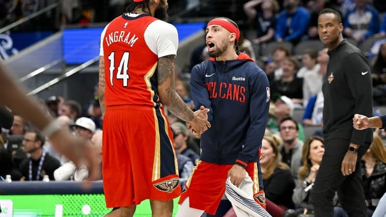 Feb 2, 2023; Dallas, Texas, USA; New Orleans Pelicans guard Jose Alvarado (15) celebrates as forward Brandon Ingram (14) comes off the court during the second half of the game against the Dallas Mavericks at the American Airlines Center. Mandatory Credit: Jerome Miron-USA TODAY Sports