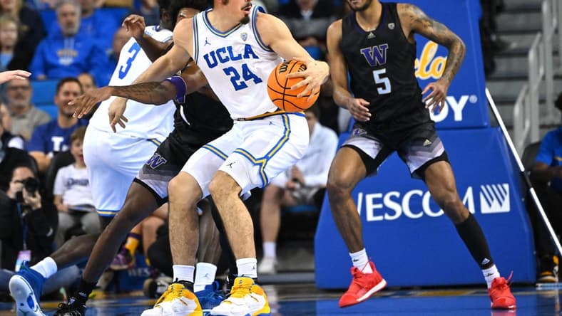 Feb 2, 2023; Los Angeles, California, USA; UCLA Bruins guard Jaime Jaquez Jr. (24) works his way to the basket past Washington Huskies guard Jamal Bey (5) in the first half at Pauley Pavilion presented by Wescom. Mandatory Credit: Jayne Kamin-Oncea-USA TODAY Sports