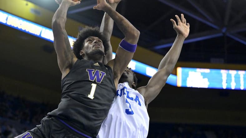 Feb 2, 2023; Los Angeles, California, USA; Washington Huskies forward Keion Brooks (1) scores past UCLA Bruins forward Adem Bona (3) in the second half at Pauley Pavilion presented by Wescom. Mandatory Credit: Jayne Kamin-Oncea-USA TODAY Sports