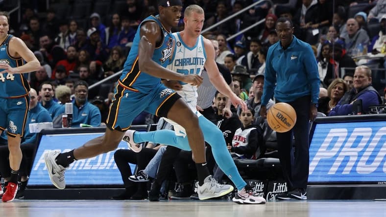 Feb 3, 2023; Detroit, Michigan, USA;  Detroit Pistons center Jalen Duren (0) and Charlotte Hornets center Mason Plumlee (24) go for the ball in the first half at Little Caesars Arena. Mandatory Credit: Rick Osentoski-USA TODAY Sports
