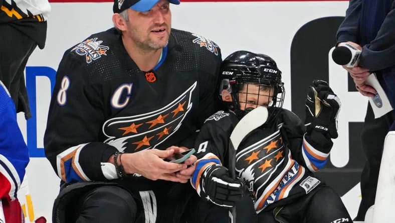 Feb 3, 2023; Sunrise, Florida, USA; Washington Capitals left wing Alex Ovechkin (8) with his son Sergei during the 2023 NHL All-Star Skills Competition at FLA Live Arena. Mandatory Credit: Jasen Vinlove-USA TODAY Sports