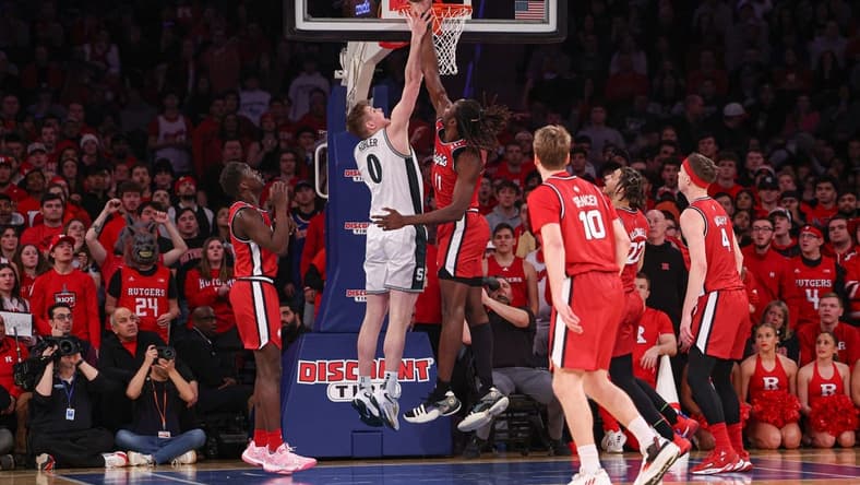 Feb 4, 2023; New York, New York, USA; Rutgers Scarlet Knights center Clifford Omoruyi (11) blocks a shot by Michigan State Spartans forward Jaxon Kohler (0) during the first half at Madison Square Garden. Mandatory Credit: Vincent Carchietta-USA TODAY Sports