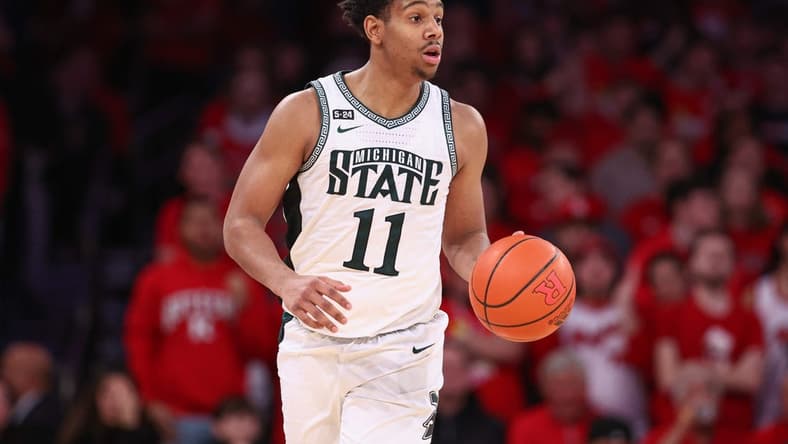 Feb 4, 2023; New York, New York, USA; Michigan State Spartans guard A.J. Hoggard (11) dribbles up court during the second half against the Rutgers Scarlet Knights at Madison Square Garden. Mandatory Credit: Vincent Carchietta-USA TODAY Sports
