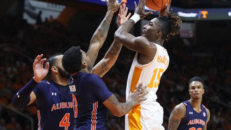 Feb 4, 2023; Knoxville, Tennessee, USA; Tennessee Volunteers guard Jahmai Mashack (15) goes to the basket against Auburn Tigers guard K.D. Johnson (0) during the first half at Thompson-Boling Arena. Mandatory Credit: Randy Sartin-USA TODAY Sports