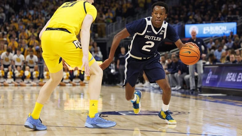 Feb 4, 2023; Milwaukee, Wisconsin, USA;  Butler Bulldogs guard Eric Hunter Jr. (2) drives towards the basket against Marquette Golden Eagles forward Ben Gold (21) during the first half at Fiserv Forum. Mandatory Credit: Jeff Hanisch-USA TODAY Sports