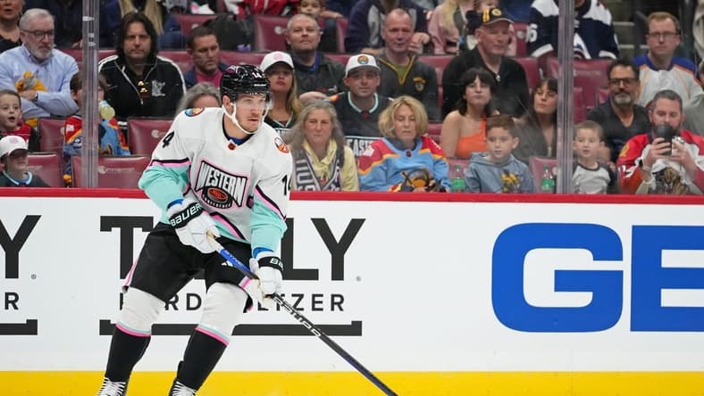 Feb 4, 2023; Sunrise, Florida, USA; Pacific Division forward Bo Horvat (14) of the New York Islanders skates with the puck against the Central Division during the first period of a semifinal game during the 2023 NHL All-Star Game at FLA Live Arena. Mandatory Credit: Jasen Vinlove-USA TODAY Sports