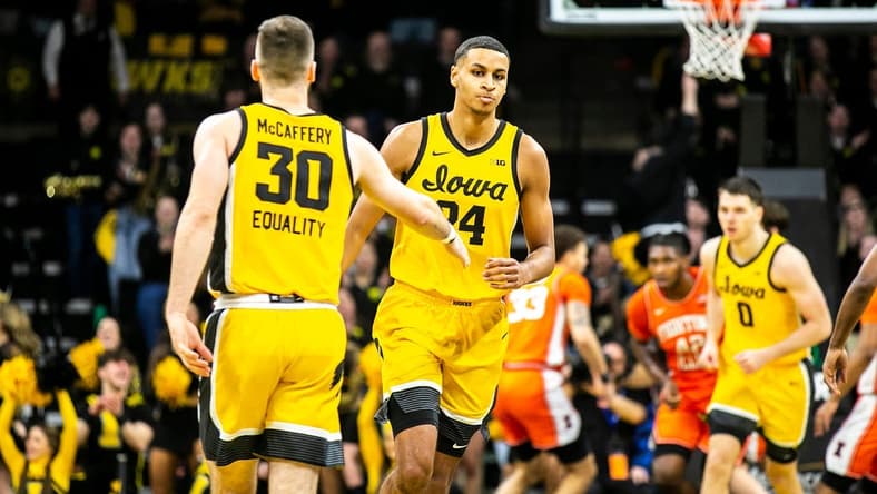 Iowa forward Kris Murray (24) gets a high-five from guard Connor McCaffery (30) during a NCAA Big Ten Conference men's basketball game against Illinois, Saturday, Feb. 4, 2023, at Carver-Hawkeye Arena in Iowa City, Iowa.

230204 Illinois Iowa Mbb 009 Jpg