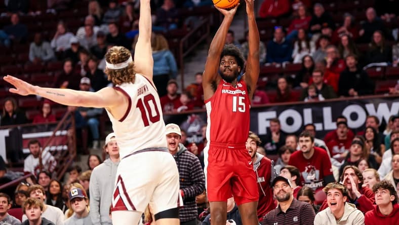 Feb 4, 2023; Columbia, South Carolina, USA; Arkansas Razorbacks forward Makhi Mitchell (15) attempts a three point basket over South Carolina Gamecocks forward Hayden Brown (10) in the first half at Colonial Life Arena. Mandatory Credit: Jeff Blake-USA TODAY Sports