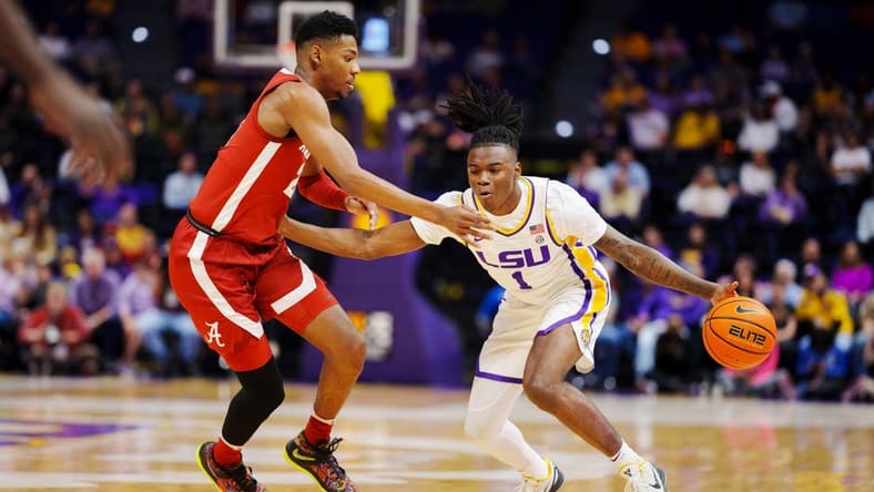 Feb 4, 2023; Baton Rouge, Louisiana, USA; LSU Tigers guard Cam Hayes (1) fights for position against Alabama Crimson Tide forward Brandon Miller (24) during the first half at Pete Maravich Assembly Center. Mandatory Credit: Andrew Wevers-USA TODAY Sports