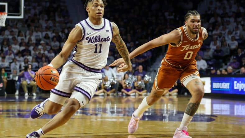Feb 4, 2023; Manhattan, Kansas, USA; Kansas State Wildcats guard Keyontae Johnson (11) dribbles the ball against Texas Longhorns forward Timmy Allen (0) during the first half at Bramlage Coliseum. Mandatory Credit: Scott Sewell-USA TODAY Sports