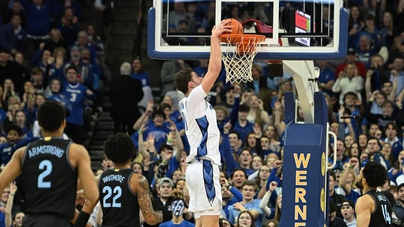 Feb 4, 2023; Omaha, Nebraska, USA; Creighton Bluejays center Ryan Kalkbrenner (11) dunks against the Villanova Wildcats in the first half at CHI Health Center Omaha. Mandatory Credit: Steven Branscombe-USA TODAY Sports