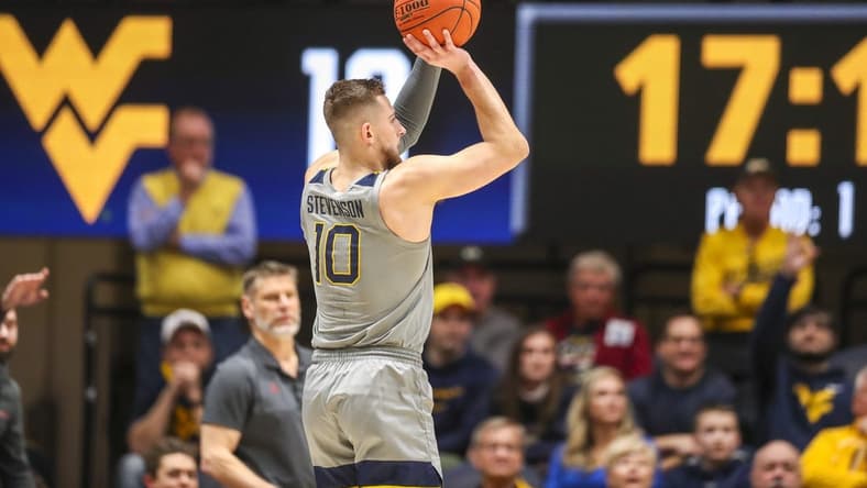 Feb 4, 2023; Morgantown, West Virginia, USA; West Virginia Mountaineers guard Erik Stevenson (10) shoots a three point basket against the Oklahoma Sooners during the first half at WVU Coliseum. Mandatory Credit: Ben Queen-USA TODAY Sports