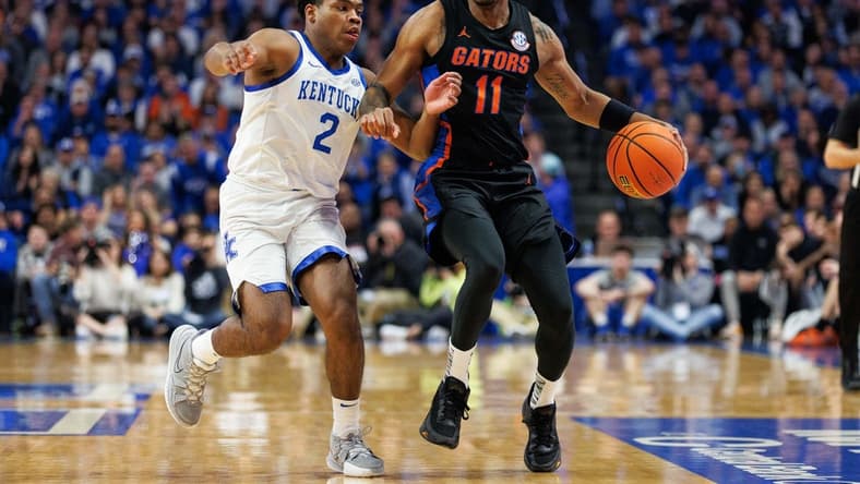 Feb 4, 2023; Lexington, Kentucky, USA; Florida Gators guard Kyle Lofton (11) brings the ball up court against Kentucky Wildcats guard Sahvir Wheeler (2) during the first half at Rupp Arena at Central Bank Center. Mandatory Credit: Jordan Prather-USA TODAY Sports