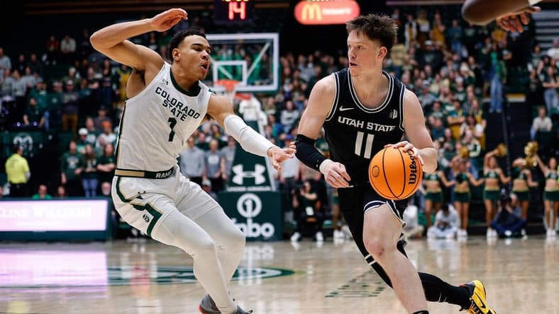 Feb 4, 2023; Fort Collins, Colorado, USA; Utah State Aggies guard Max Shulga (11) drives to the net against Colorado State Rams guard John Tonje (1) in the first half at Moby Arena. Mandatory Credit: Isaiah J. Downing-USA TODAY Sports