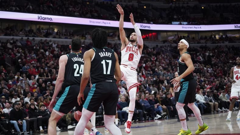 Feb 4, 2023; Chicago, Illinois, USA; Chicago Bulls guard Zach LaVine (8) shoots a three point basket against the Portland Trail Blazers during the first quarter at United Center. Mandatory Credit: David Banks-USA TODAY Sports