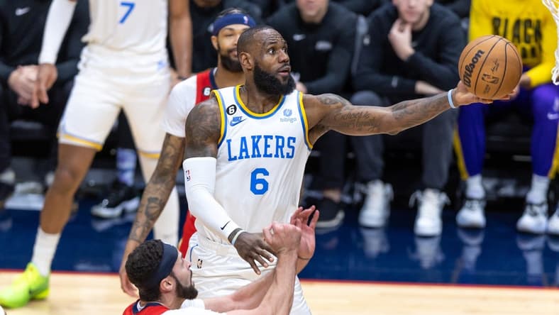 Feb 4, 2023; New Orleans, Louisiana, USA; Los Angeles Lakers forward LeBron James (6) drives to the basket against New Orleans Pelicans forward Larry Nance Jr. (22) during the second half at Smoothie King Center. Mandatory Credit: Stephen Lew-USA TODAY Sports
